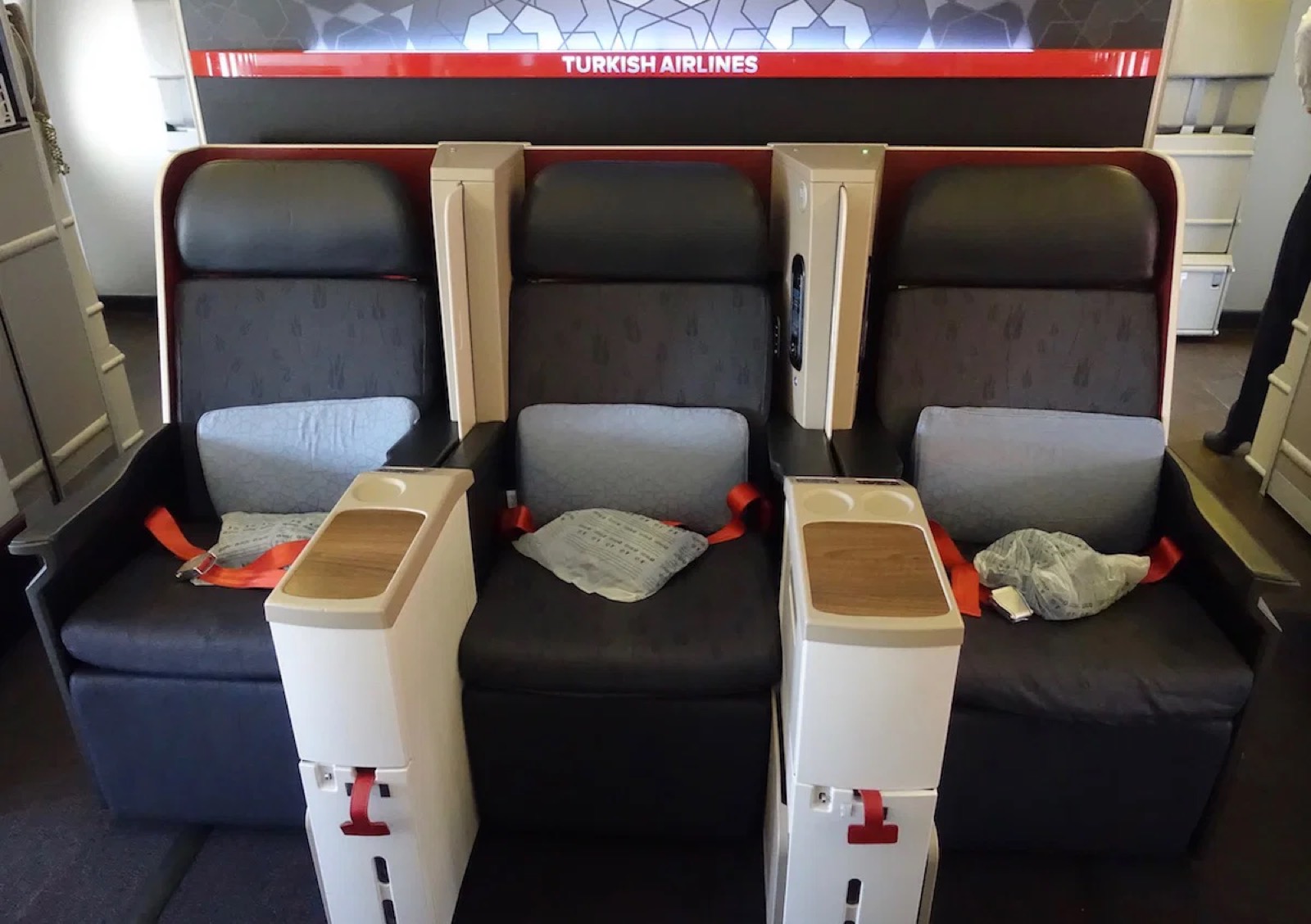 The current Turkish Airlines business class on the Boeing 777: three seats side by side with no dividers between them