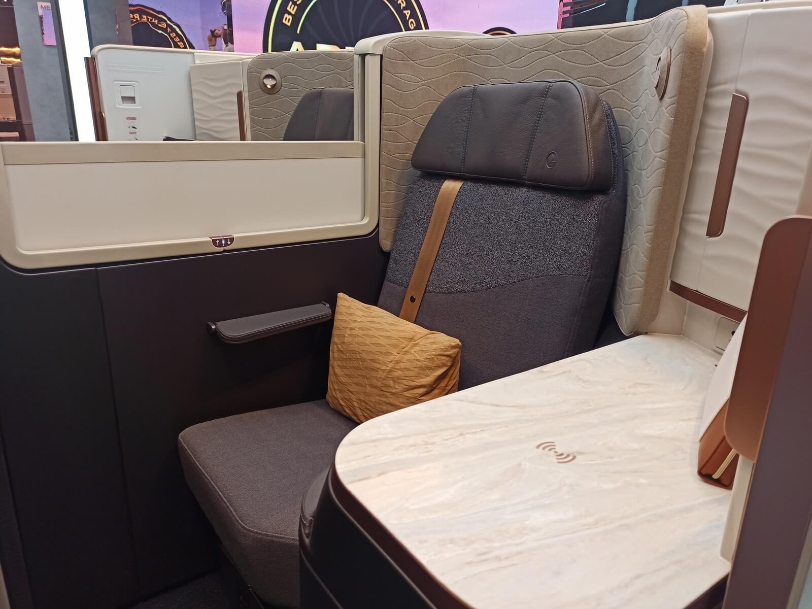 The Turkish Airlines Crystal business class suite, a single seat with a closing door, marble-effect table and a wide screen